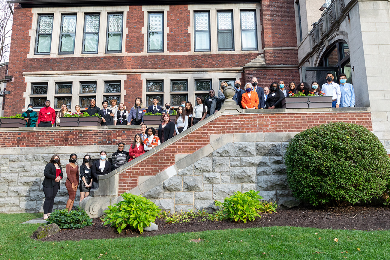 scholars on stairs